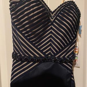 Gorgeous floor length blue satin dress with rhinestones.  Size 6